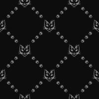 Simple seamless vector pattern with cats face and paw prints in rhombus grid. White on black. Good for cats goods decoration