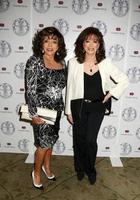 LOS ANGELES, APR 22 -  Joan Collins, Jackie Collins at the Women s Guild Cedars-Sinai Luncheon at Beverly Hills Hotel on April 22, 2014 in Beverly Hills, CA photo