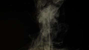 White smoke, fog, mist, vapor on a black background. 4K footage. video