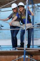 LOS ANGELES, MAR 8 -  Kelly Sullivan, Lisa LoCicero at the 5th Annual General Hospital Habitat for Humanity Fan Build Day at Private Location on March 8, 2014 in Lynwood, CA photo