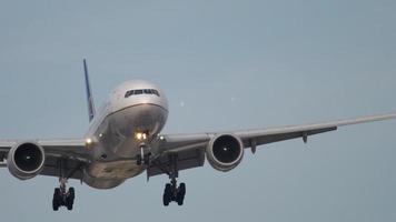 FRANKFURT AM MAIN, GERMANY JULY 18, 2017 - United Airlines Boeing 777 approaching at early morning, runway 07L. Fraport, Frankfurt, Germany video