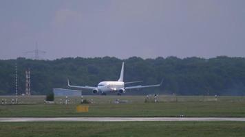 DUSSELDORF, GERMANY JULY 24, 2017 - Air Egypt Boeing 737 braking after landing at early morning. Dusseldorf airport video