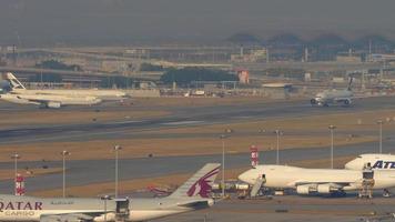 HONG KONG NOVEMBER 10, 2019 - Cathay Pacific Boeing 777 B KPE at a runway start for take off from Hong Kong international airport and another Cathay Pacific Boeing 777 behind it waiting for its turn video
