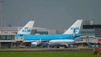 AMSTERDAM, THE NETHERLANDS JULY 27, 2017 - LOT Embraer ERJ 175 taxing before departure and KLM Royal Dutch Airlines Boeing 787 Dreamliner PH BHL taxiing after landing, Shiphol Airport, Amsterdam video