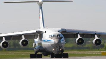 NOVOSIBIRSK, RUSSIAN FEDERATION JUNY 12, 2022 - Transport aircraft IL 76 turning on the runway at Tolmachevo airport. Il 76 Soviet heavy military transport aircraft video