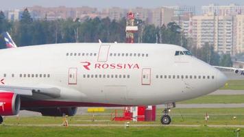 MOSCOW, RUSSIAN FEDERATION SEPTEMBER 12, 2020 - Rossiya Boeing 747 EI XLF lining up on the runway before departure behind Pilatus PC 12 turboprop aircraft running for take off video