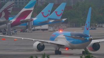 PHUKET, THAILAND DECEMBER 3, 2016 - Thomson Boeing 787 Dreamliner G TUIF taxiing after landing in Phuket airport at early morning. View from the top floor of the hotel video