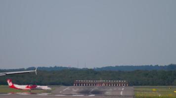 DUSSELDORF, GERMANY JULY 21, 2017 - Bombardier Dash 8 Q400 Airberlin cross runway after landing. Dusseldorf airport video