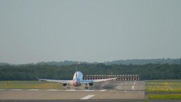 Jet airplane departure and climb at sunset. Dusseldorf airport video