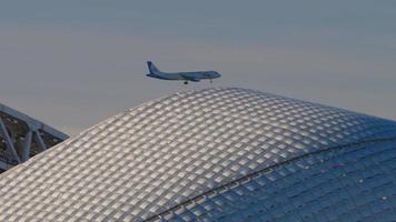 SOCHI, RUSSIAN FEDERATION NOVEMBER 17, 2020 - Ural Airlines Airbus A320 on final approach to Sochi flying over sport venues of Sochi Olympic Park. video