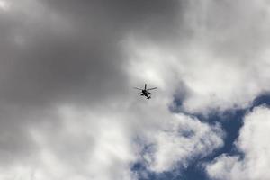a helicopter flying in sky photo