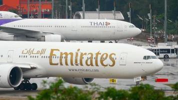 PHUKET, THAILAND DECEMBER 3, 2016 - Emitates Boeing 777 A6 EPA taxiing before departure from Phuket airport. video