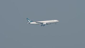 HONG KONG NOVEMBER 10, 2019 - Long shot Cathay Pacific Airbus A330 flies for landing on internation airport, Hong Kong. video