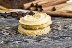 cinnamon, cookies and aromatic coffee beans photo