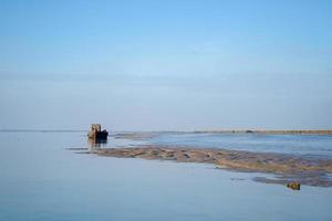 Harty Island, Kent, UK, 2017. View of an Old Boat on the River Swale photo