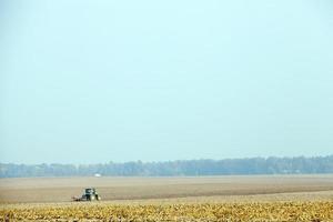 Field with tractor, close up photo