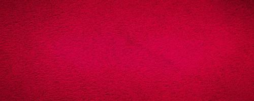 Red suede genuine leather background. Velvet red background close-up photo. photo