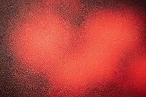 Red metal background. Light and shadow painted with red paint metal texture. photo