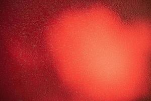 Red metal background. Light and shadow painted with red paint metal texture. photo