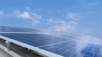 Solar module panels against blue sky background. Environmental energy resources concept. photo