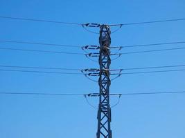 Electric towers in rural areas that bring electricity to our homes photo