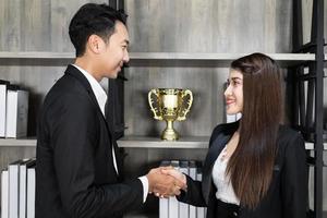 business success concept, Businessman And Businesswoman Shaking Hands. business people handshaking photo