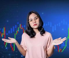 Stressed young investor woman feeling strain with trading against stock market and candlestick graphic on background in Bear Market and trading indicators. Failure economic crisis concept. photo