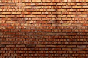 New brick wall from red bricks close-up texture. photo