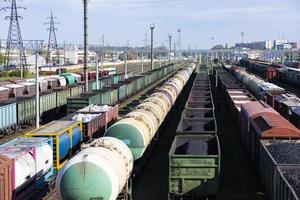 Freight railway cars at the railway station. Top view of cargo trains.Wagons with goods on railroad. Heavy industry. Industrial conceptual scene with trains. selective focus photo