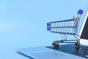 Shopping cart and computer mouse, online shopping concept. Copy space. photo