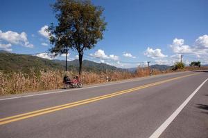 Travel on a motorbike on the roads outside of the city in Thailand. photo