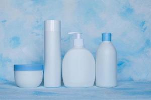 A set of white, plastic, containers. Packaging, bottle template for cosmetics, antiseptic, with detergents and chemical cleaners, for medical and cosmetic products. photo