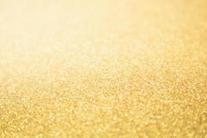 Abstract Gold glitter festive Christmas texture background blur with bokeh light photo