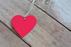 Heart paper on old wood, Background for Valentines Day photo