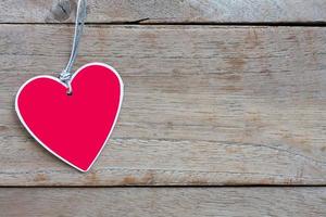 Heart paper on old wood, Background for Valentines Day photo