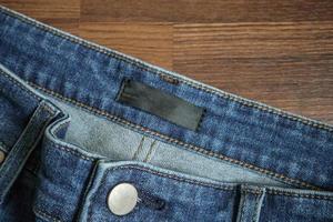Blue jeans with blank clothing label tag photo