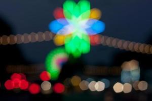 beautiful background of bokeh lights at night on road with car photo