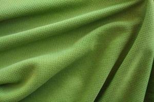 crumpled green fabric texture background photo