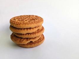 pile of mouthwatering biscuits isolated on white background photo