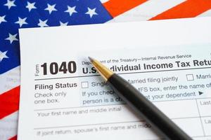 Tax form 1040 U.S. Individual Income Tax Return, business finance concept. photo