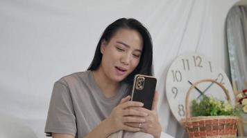 Happy woman making video call with couple.