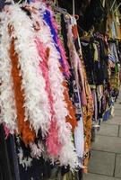 Feather boas in a market photo