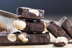 pieces of chocolate with hazelnuts photo