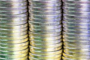 coins of silver color illuminated with yellow green color photo