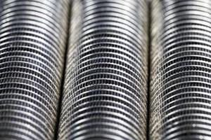 coins of silver color stacked together photo