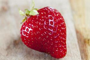 One fresh red strawberry photo