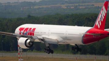 FRANKFURT AM MAIN, GERMANY JULY 19, 2017 - LATAM Brasil Boeing 777 PT MUC approaching on runway 25R. Fraport, Frankfurt, Germany video
