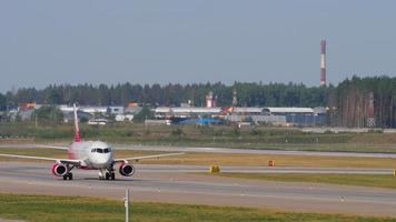 MOSCOW, RUSSIAN FEDERATION JULY 31, 2021 - Airplane Sukhoi Superjet 100 of Rossiya rides at Sheremetyevo Airport SVO. Tourism and travel concept video