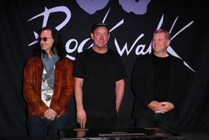 LOS ANGELES, NOV 20 - RUSH, Geddy Lee, Neil Peart, Alex Lifeson at the ceremony where RUSH is Inducted Into Guitar Center s RockWalk at Guitar Center on November 20, 2012 in Los Angeles, CA photo