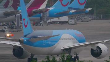PHUKET, THAILAND DECEMBER 3, 2016 - Thomson Boeing 787 Dreamliner G TUIF taxiing after landing in Phuket airport at early morning. View from the top floor of the hotel video